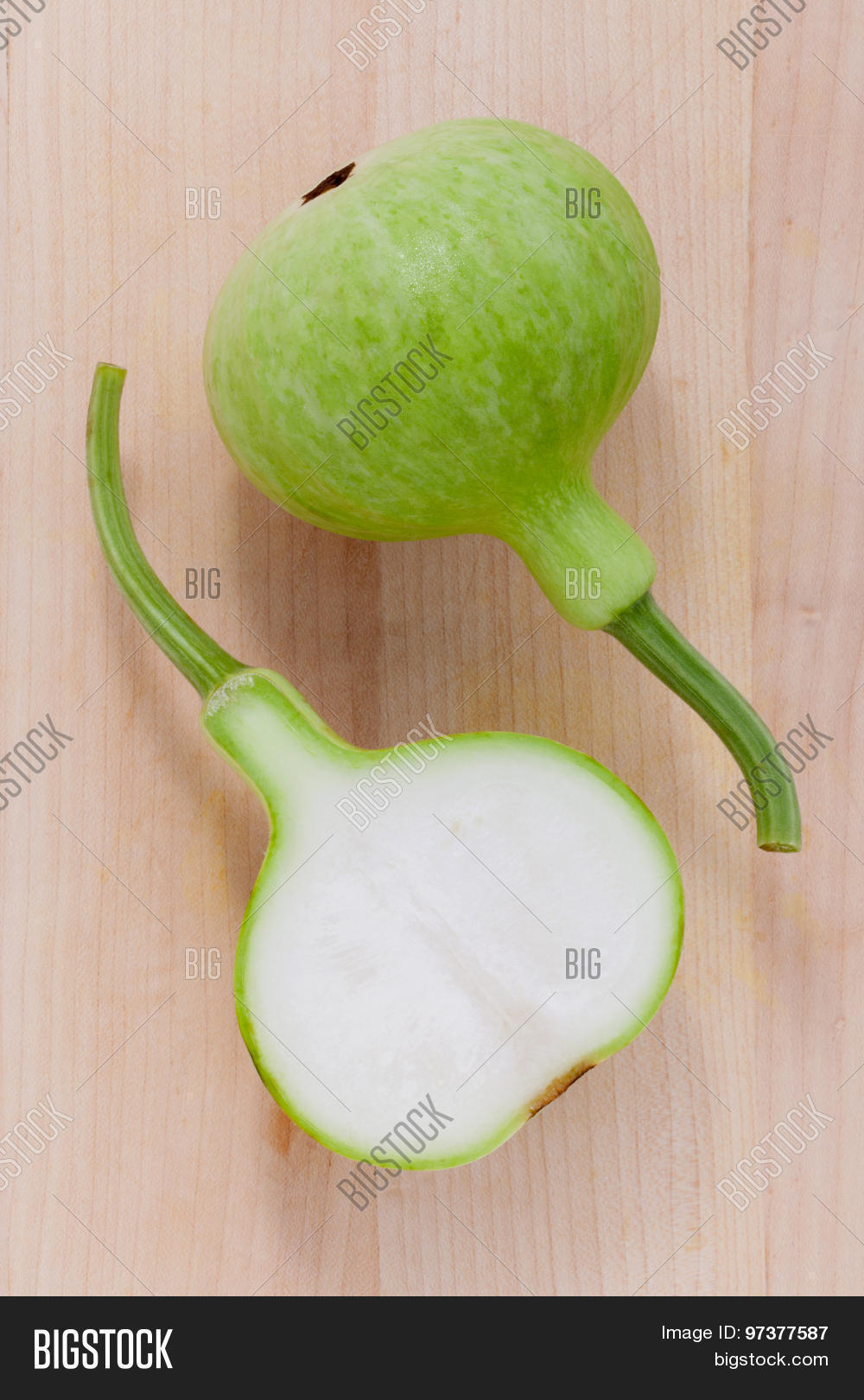 halved bottle gourdcalabash gourd flowered gourd on wooden