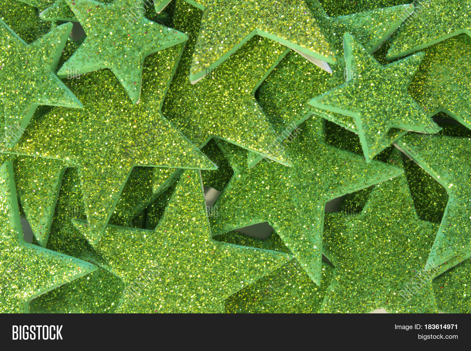 this is a photograph of green glitter stars background