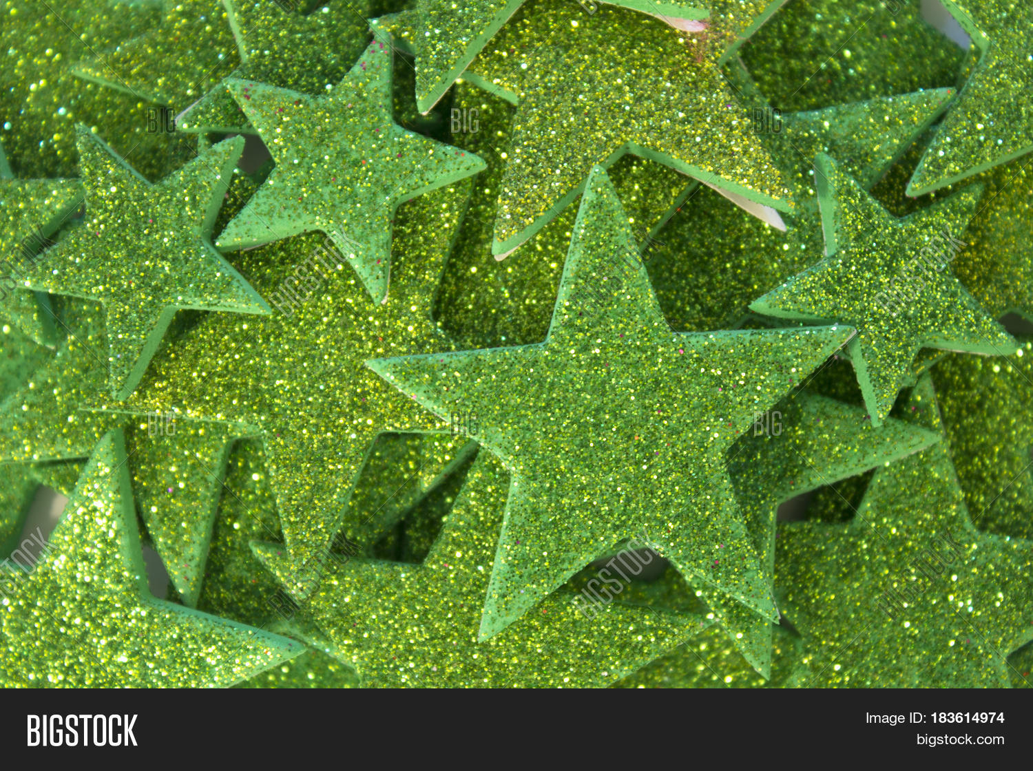 this is a photograph of green glitter stars background