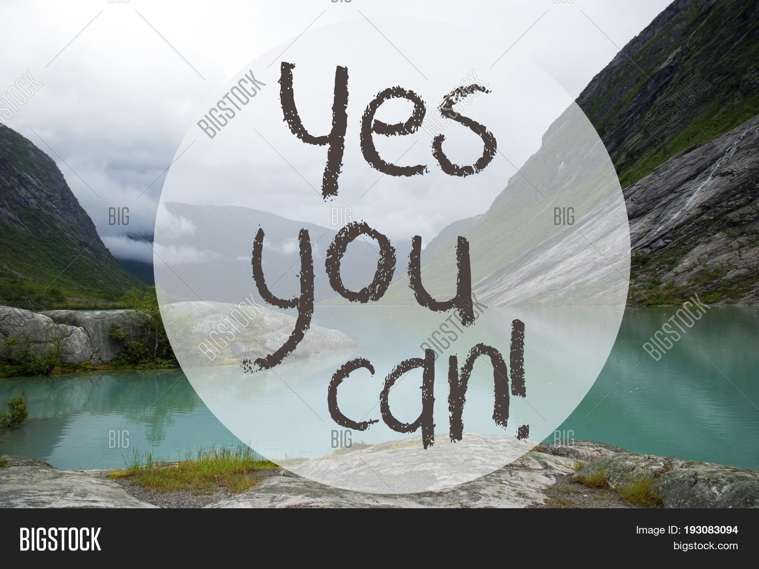 english text yes you can. lake with mountains in norway.