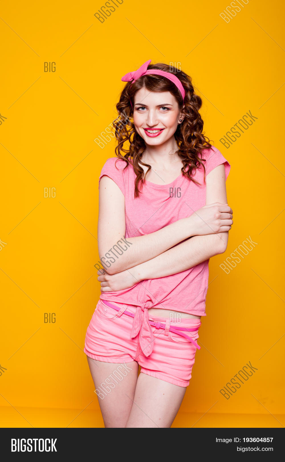 girl pinup-style in a pink dress 1 2