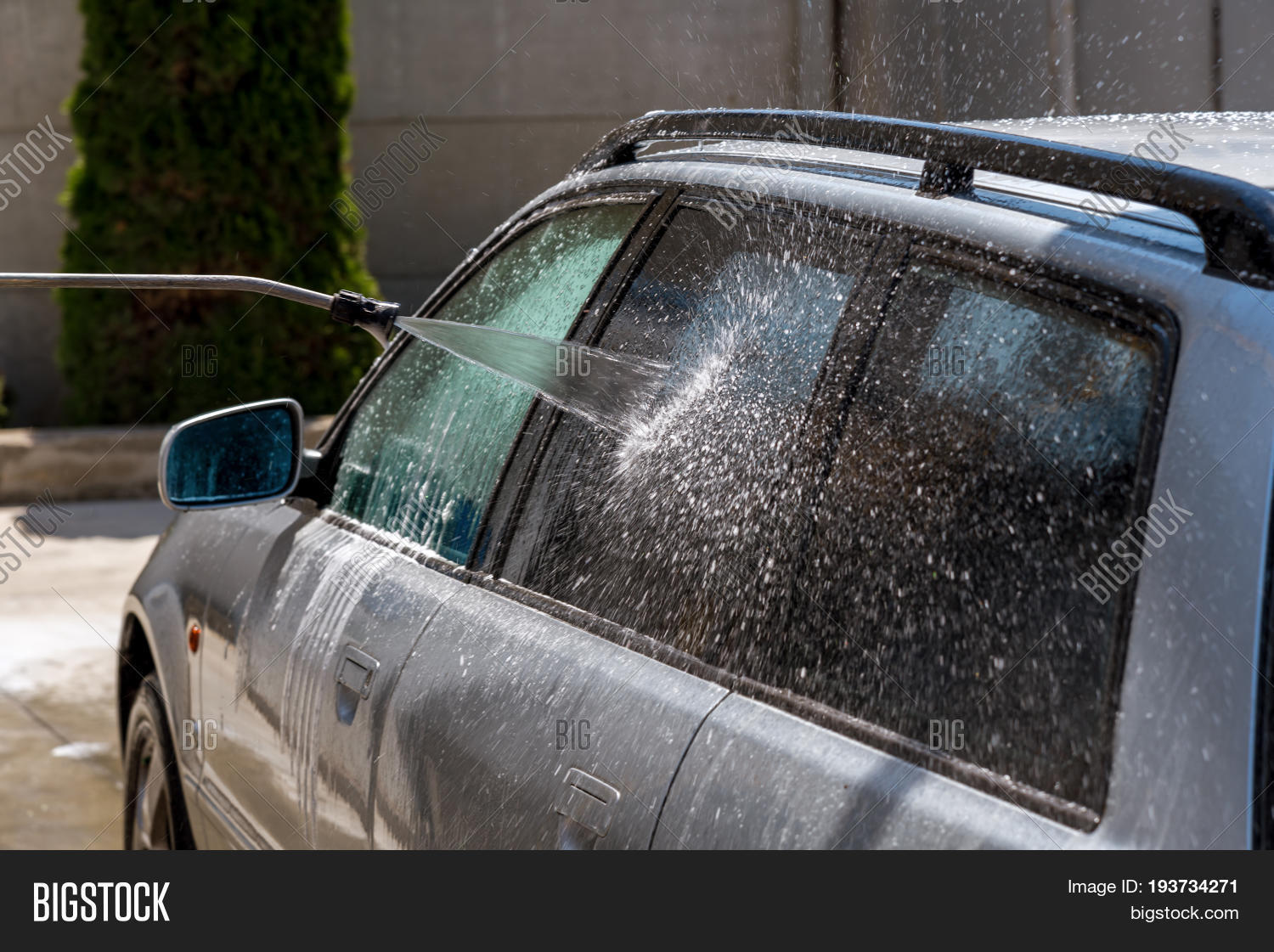 car washing with flowing water. outdoor self service cleaning ca