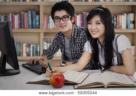 two college students studying together