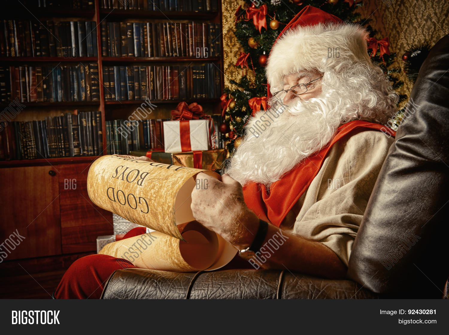 santa claus dressed in his home clothes sitting in the room by