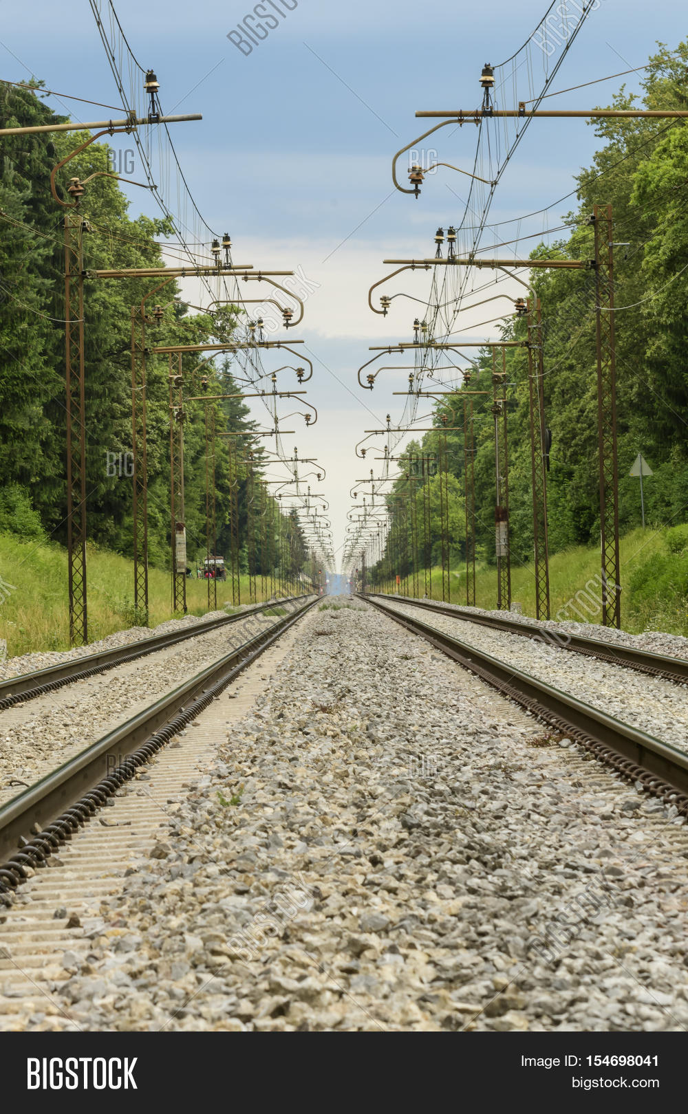 two parallel railroad tracks converging on the horizon