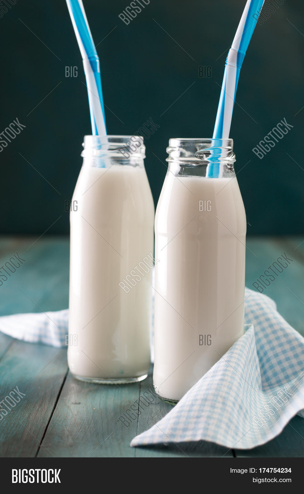 retro milk bottle with striped drinking straw and further