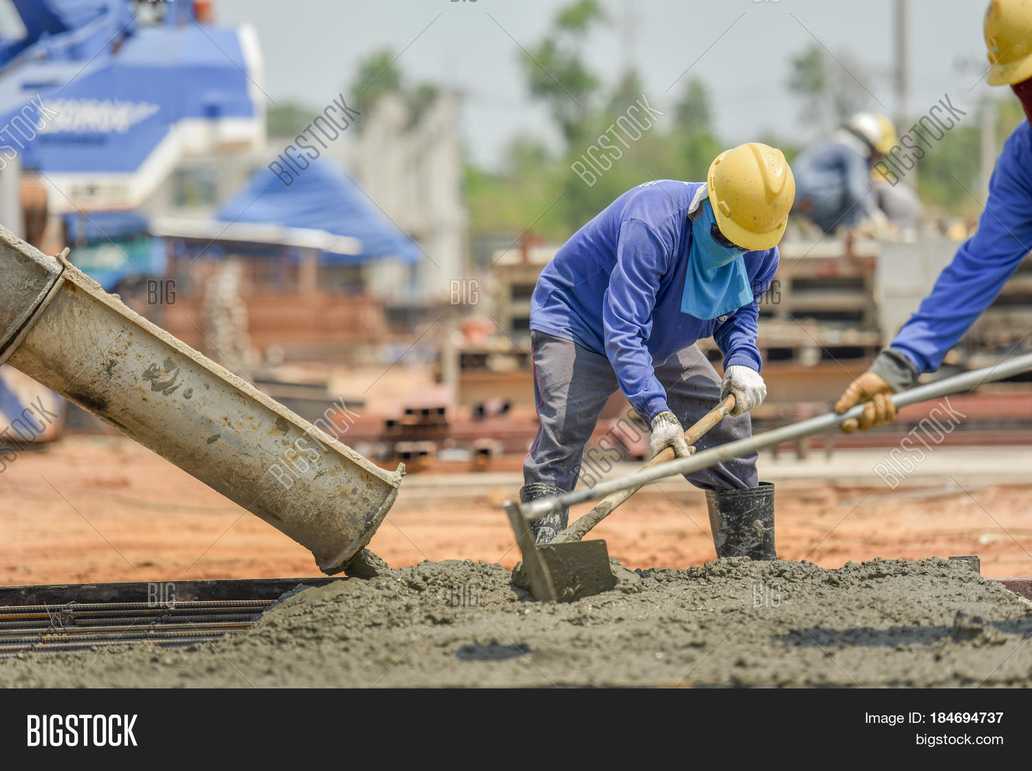 construction worker concrete pouring during commercial