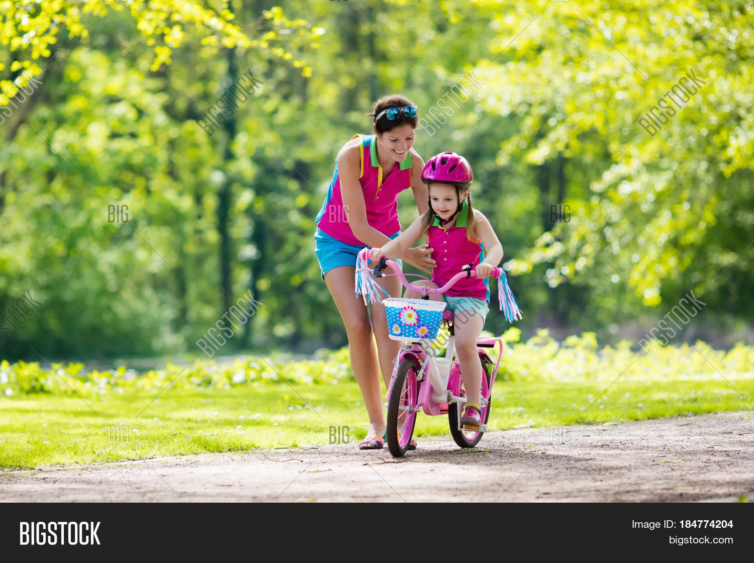 kid on bicycle in sunny park.