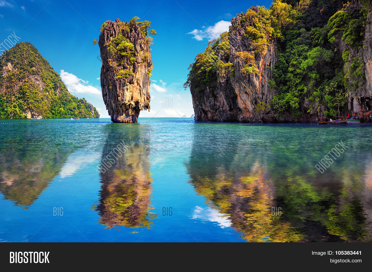 james bond island reflects in water near phuket