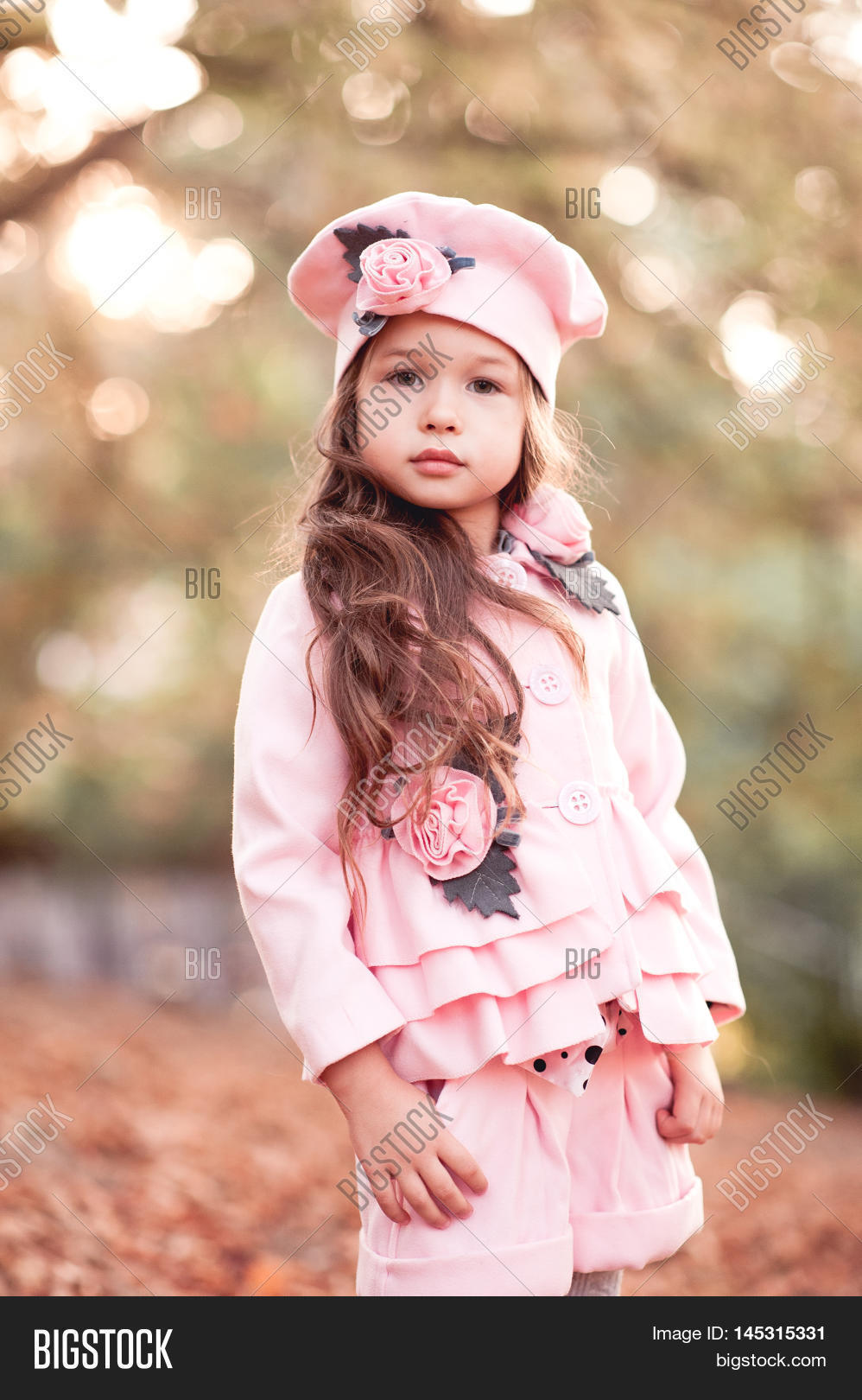 cute baby girl 4-5 year old wearing stylish winter jacket shorts