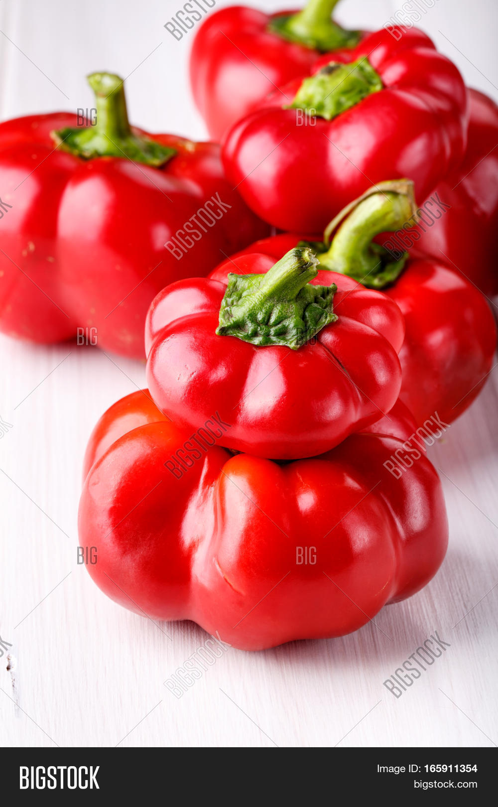 tomato shaped sweet pepper on white.