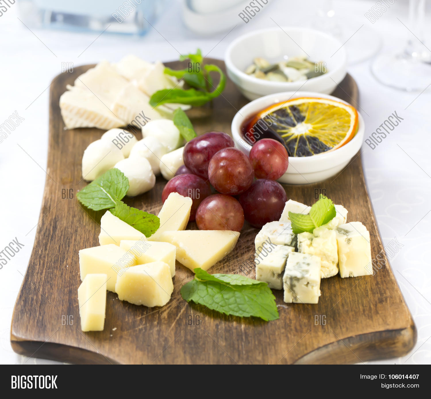 cheese plate with a large decorated the assortment of mint