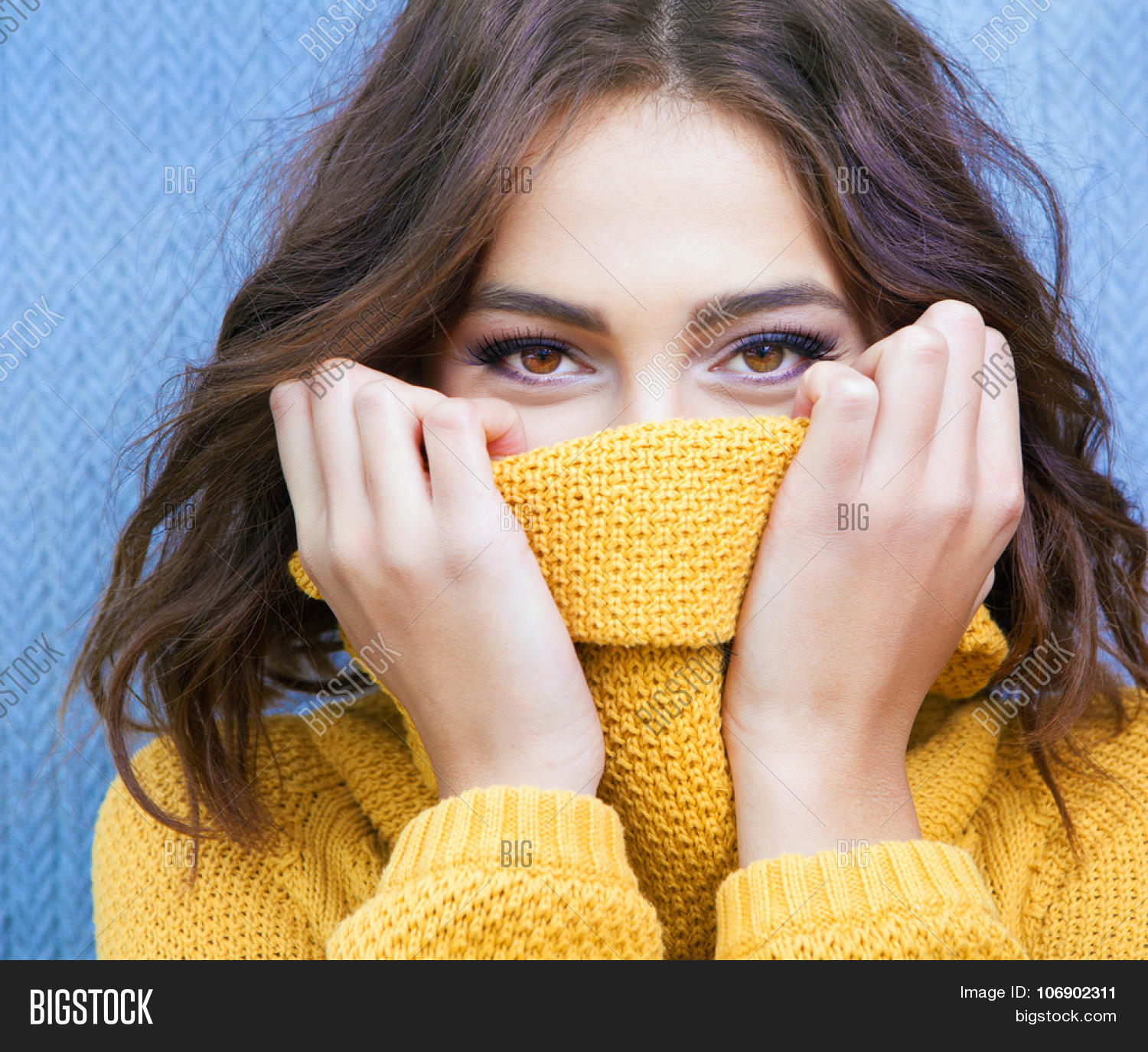 beautiful natural young shy brunette woman with smiling eyes