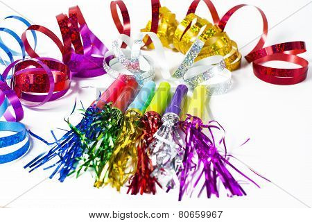 party horn blower with colored streamers on white background