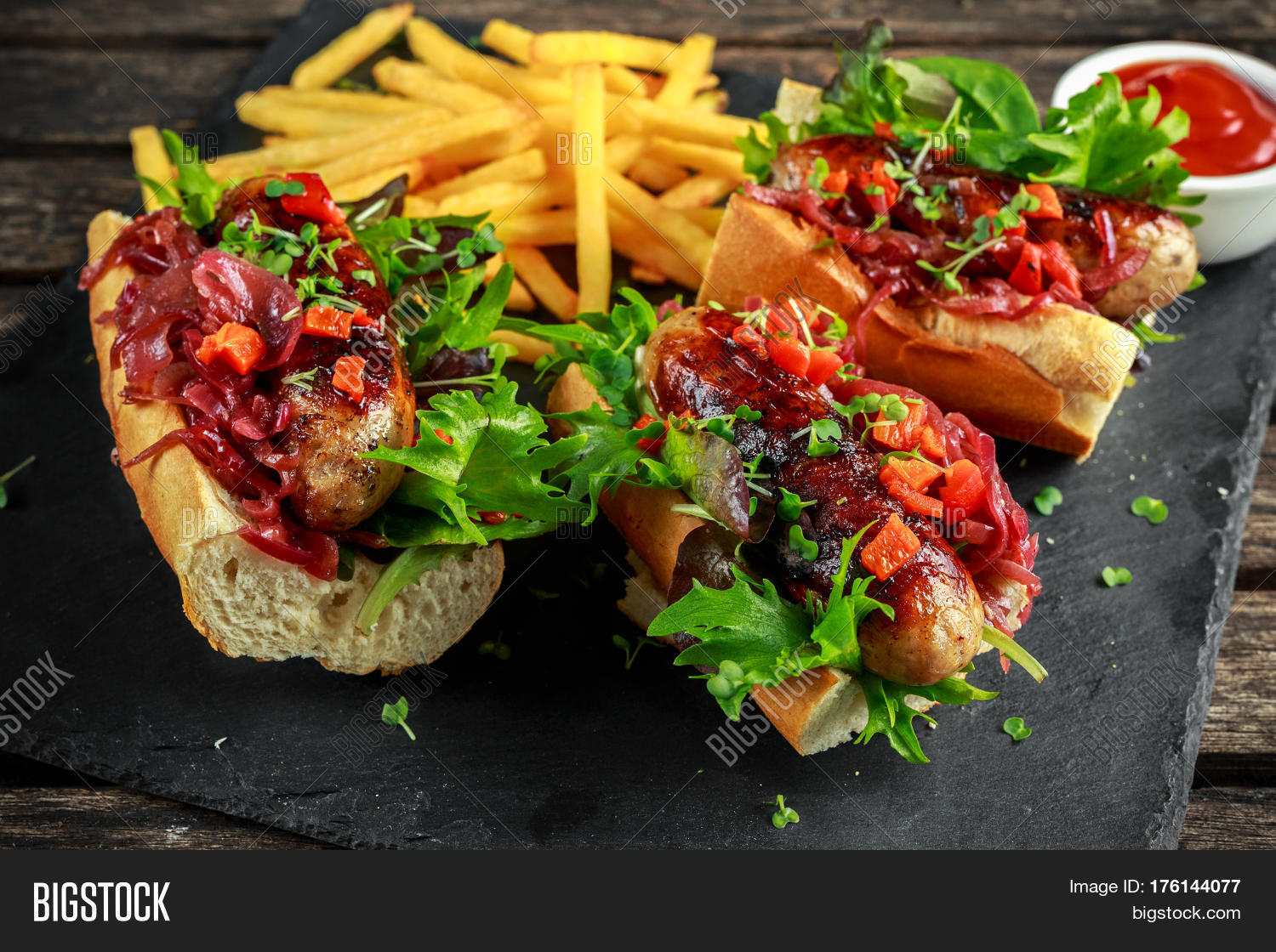 cumberland sausage hot dogs with caramelized onion, roasted red