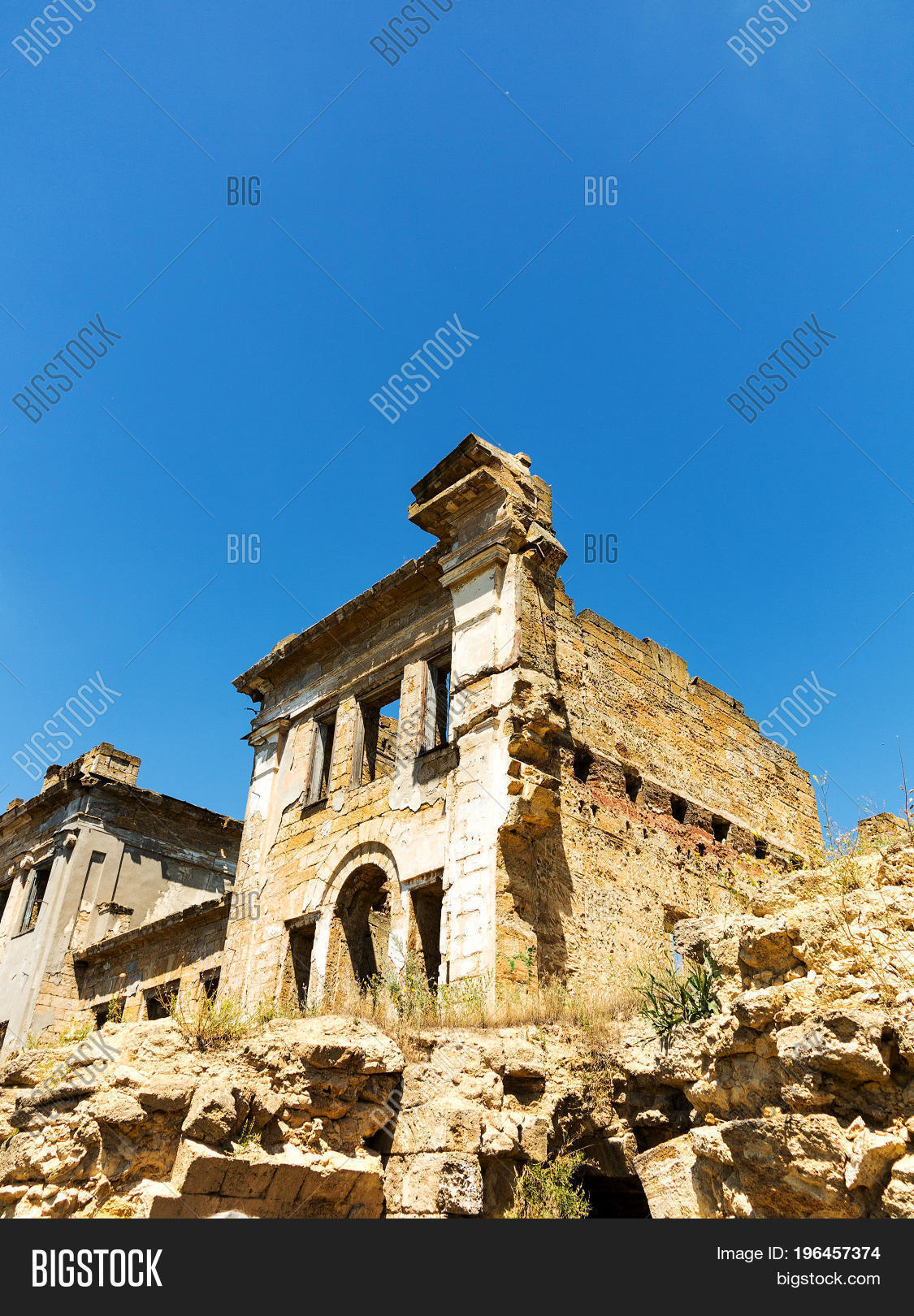 of facade of an abandoned ruined building of an ancient castle