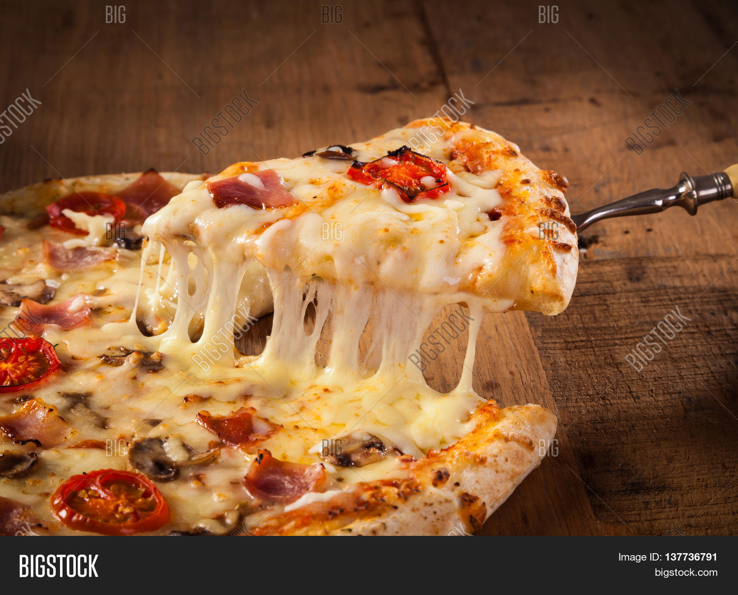 a slice of hot pizza just from the oven with melted cheese