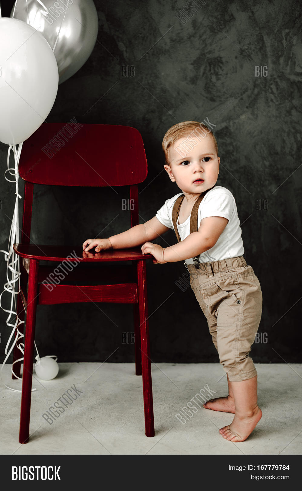 portrait of lovely little boy happy smiling celebrating 1 year