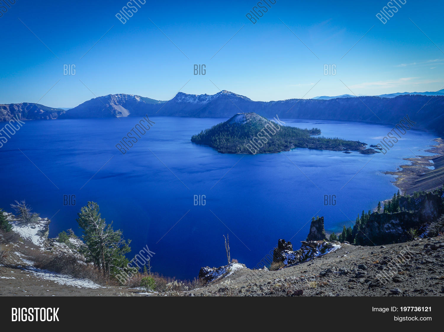 looking at the vast expanse of the crater lake caldera in oregon