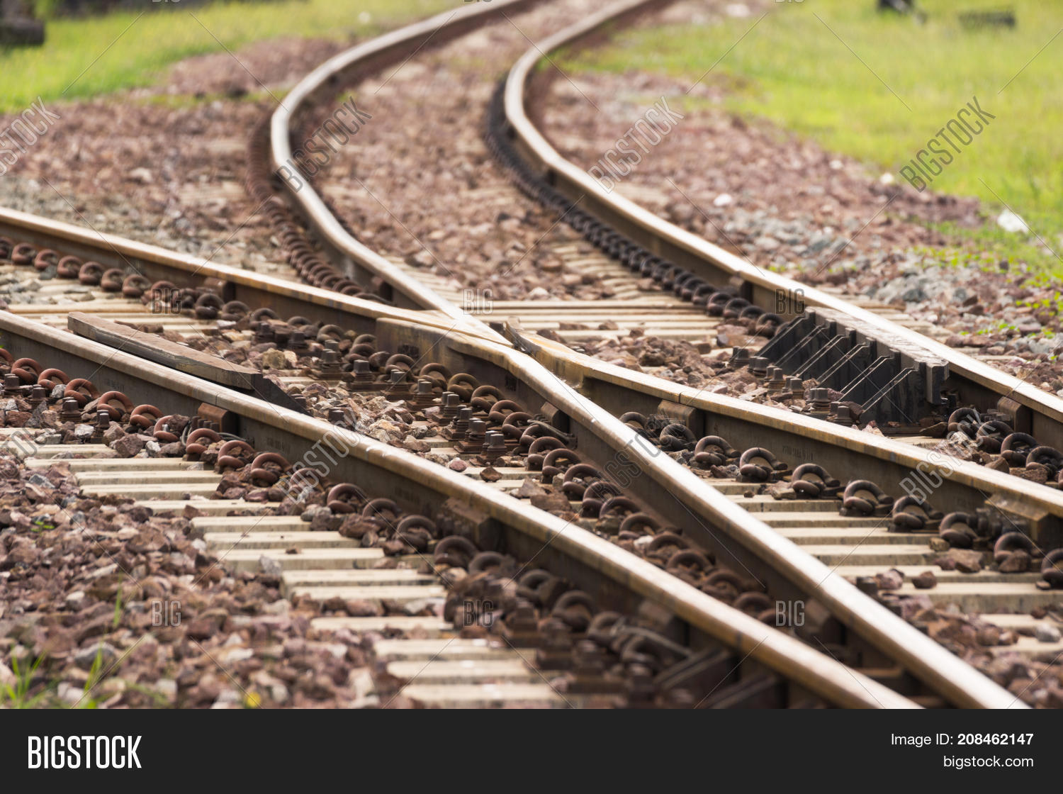 old railroad crossing, two railway tracks merge at station