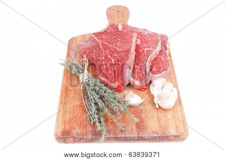 fresh raw beef meat fillet flesh with peppercorn and thyme ready