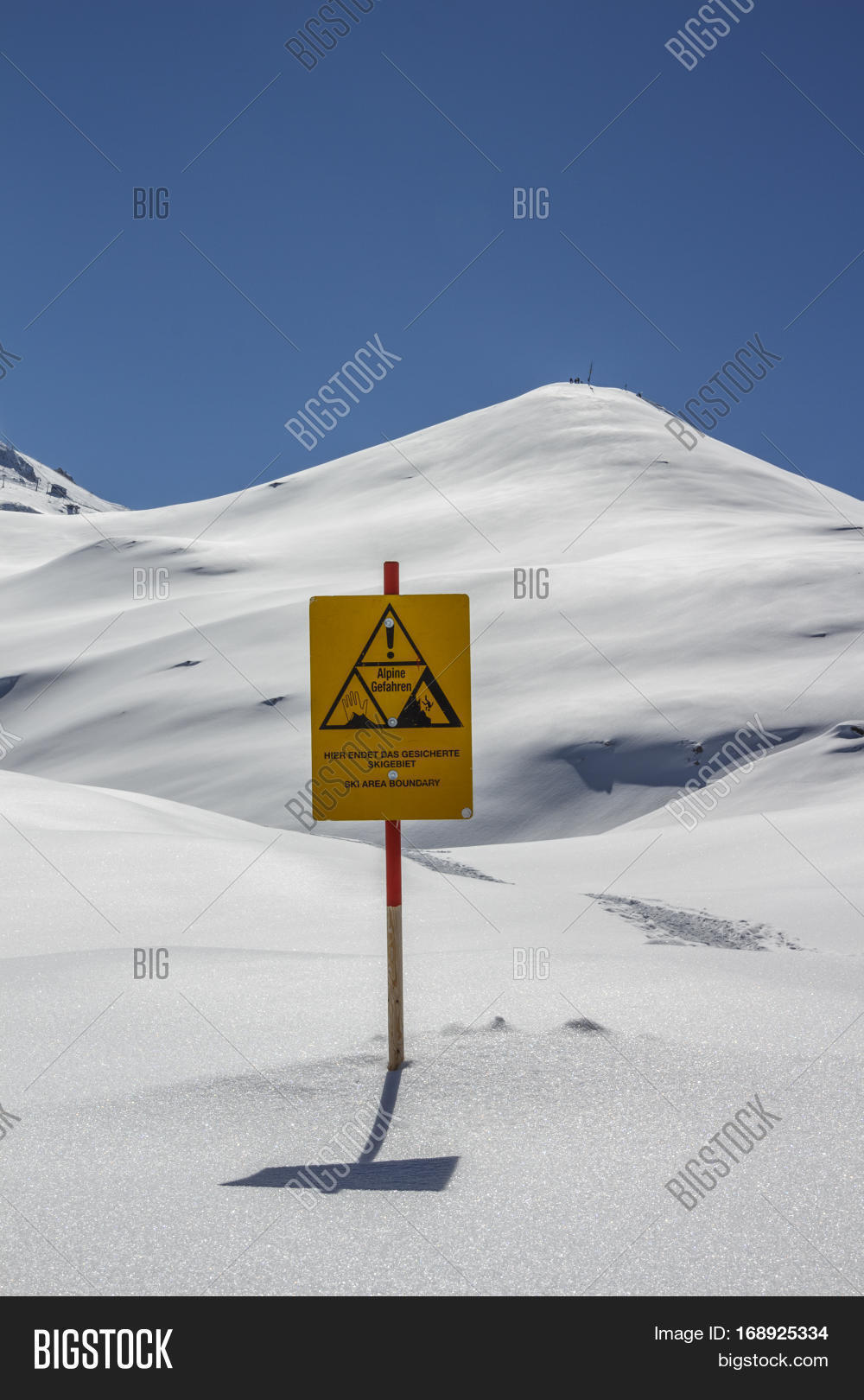 warning sign indicating the ski area boundary of a at the hinter