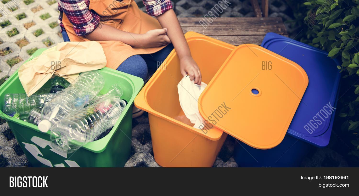african descent kid separating recyclable trash