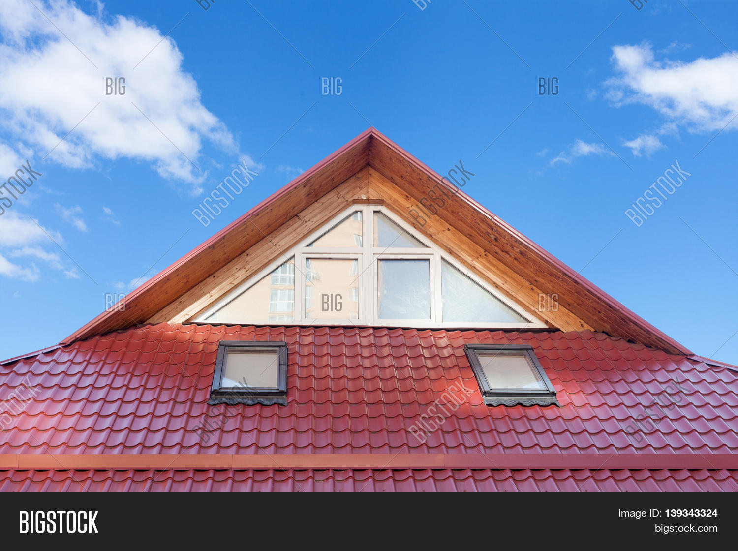 red metal tiled roof with new dormers roof windows skylights and