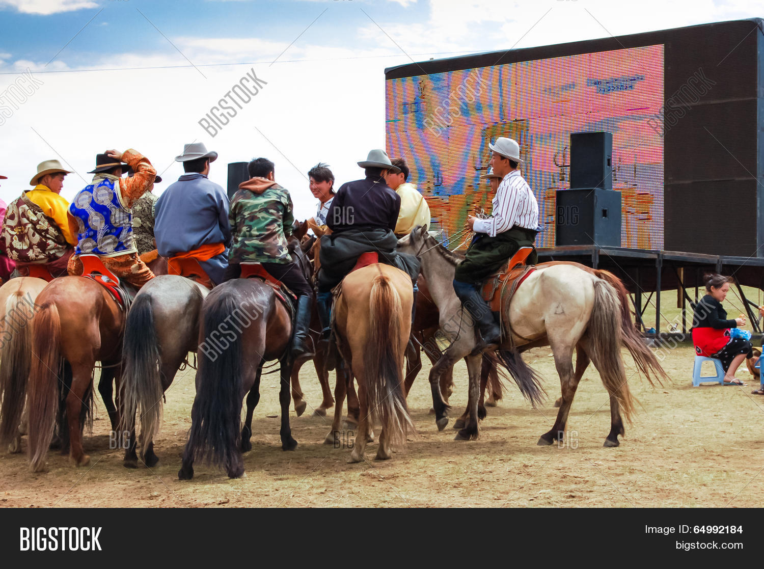 horseback spectators in front of tv screen, nadaam horse race