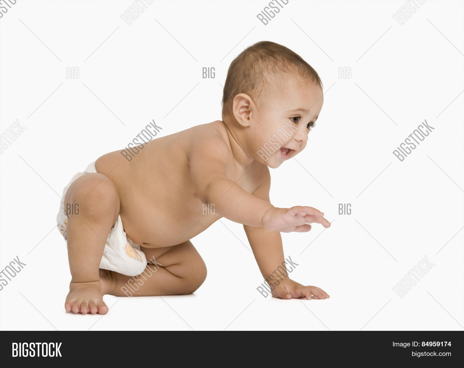 baby boy crawling and smiling
