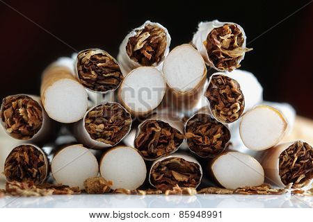 broken cigarette ends in a heap concept for quitting smoking and