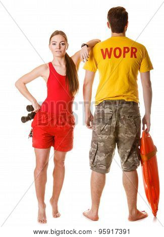 lifeguards with binoculars and rescue buoy.