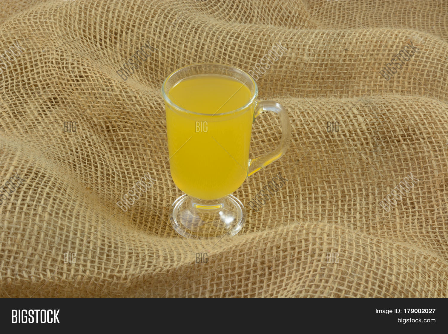 yellow passionfruit fruit juice drink in glass on