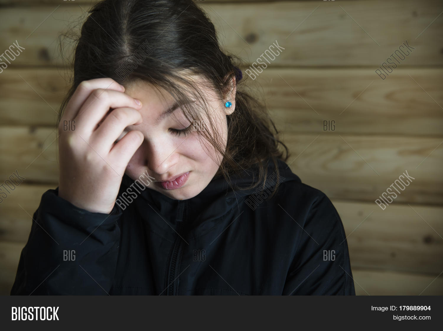 portrait of a sad girl, 10-11 years, brunette