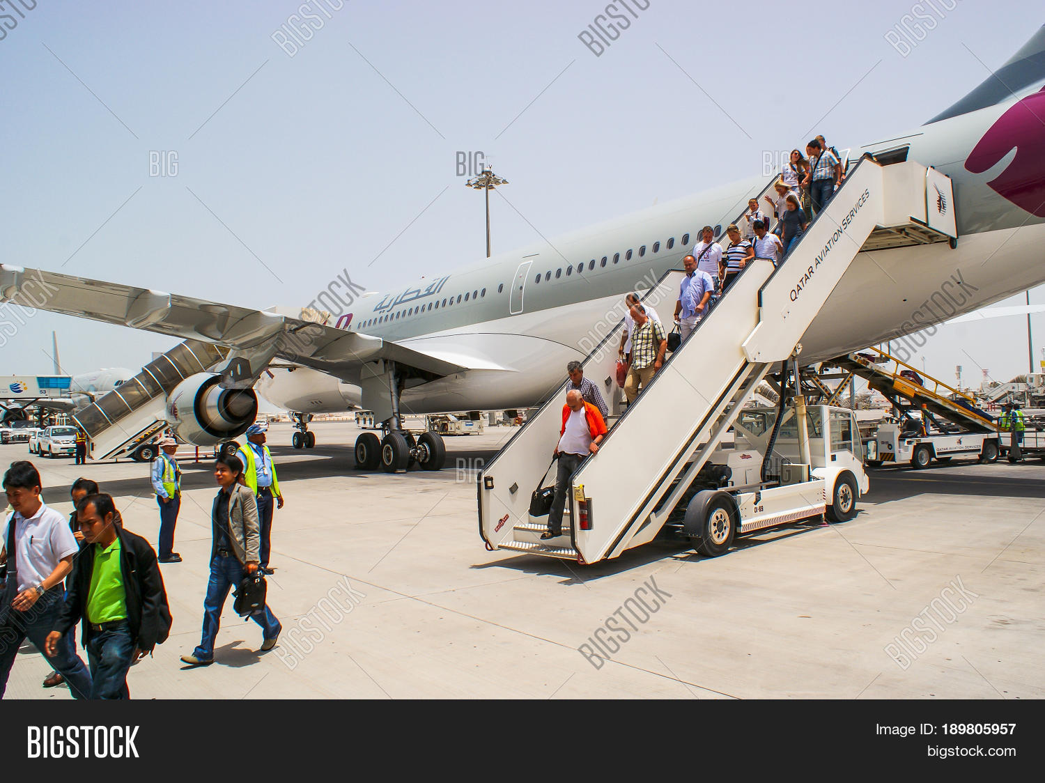 passengers disembark from the aircraft qatar airways at the