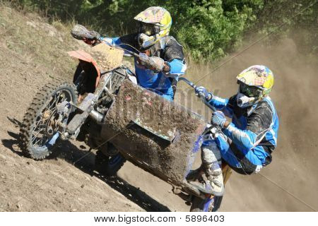 Motocross sidecar (Sidecarcross) team climb a hill : Bigstock