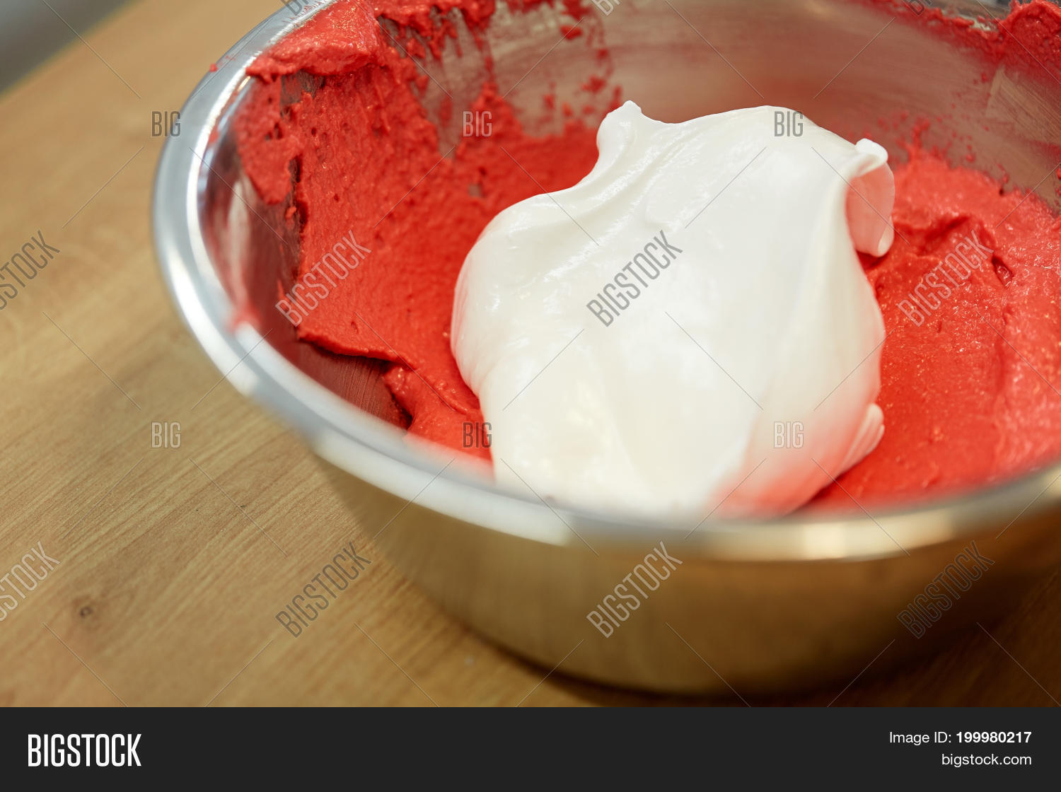 food and baking concept - macaron batter with whipped egg whites